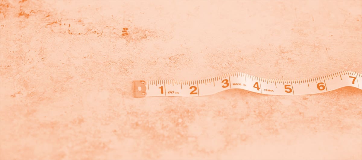 Measuring tape displaying 7 inches on a granite countertop