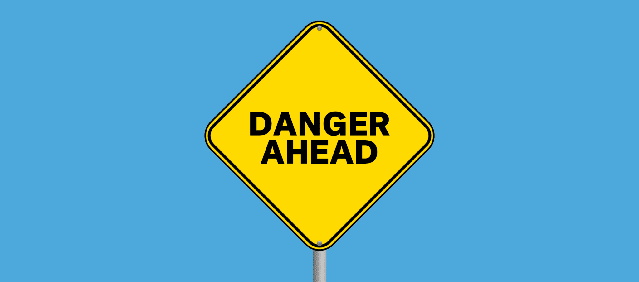 Yellow diamond road sign reading "DANGER AHEAD" on a light blue background